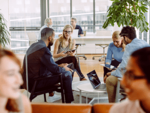 Co-workers meet in an office