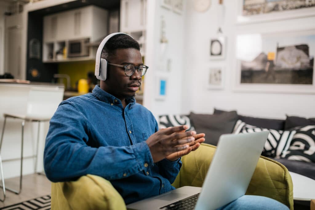 Young male working from home using a laptop