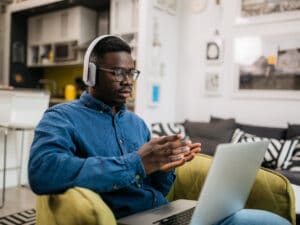 Young male working from home using a laptop