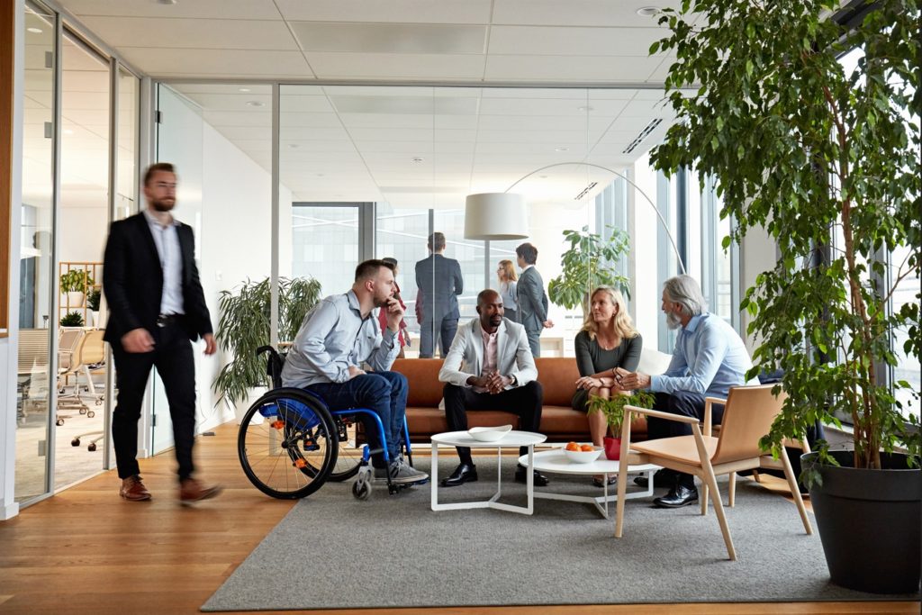 modern office environment, co-workers chatting