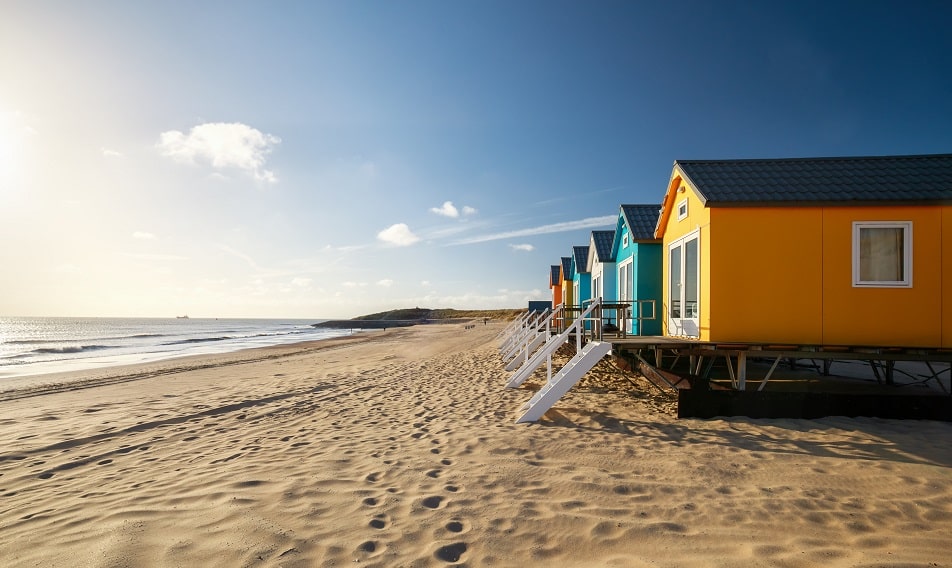 small colourful buildings on sunny beach