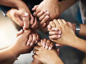 Shot of a group of unrecognizable people holding hands