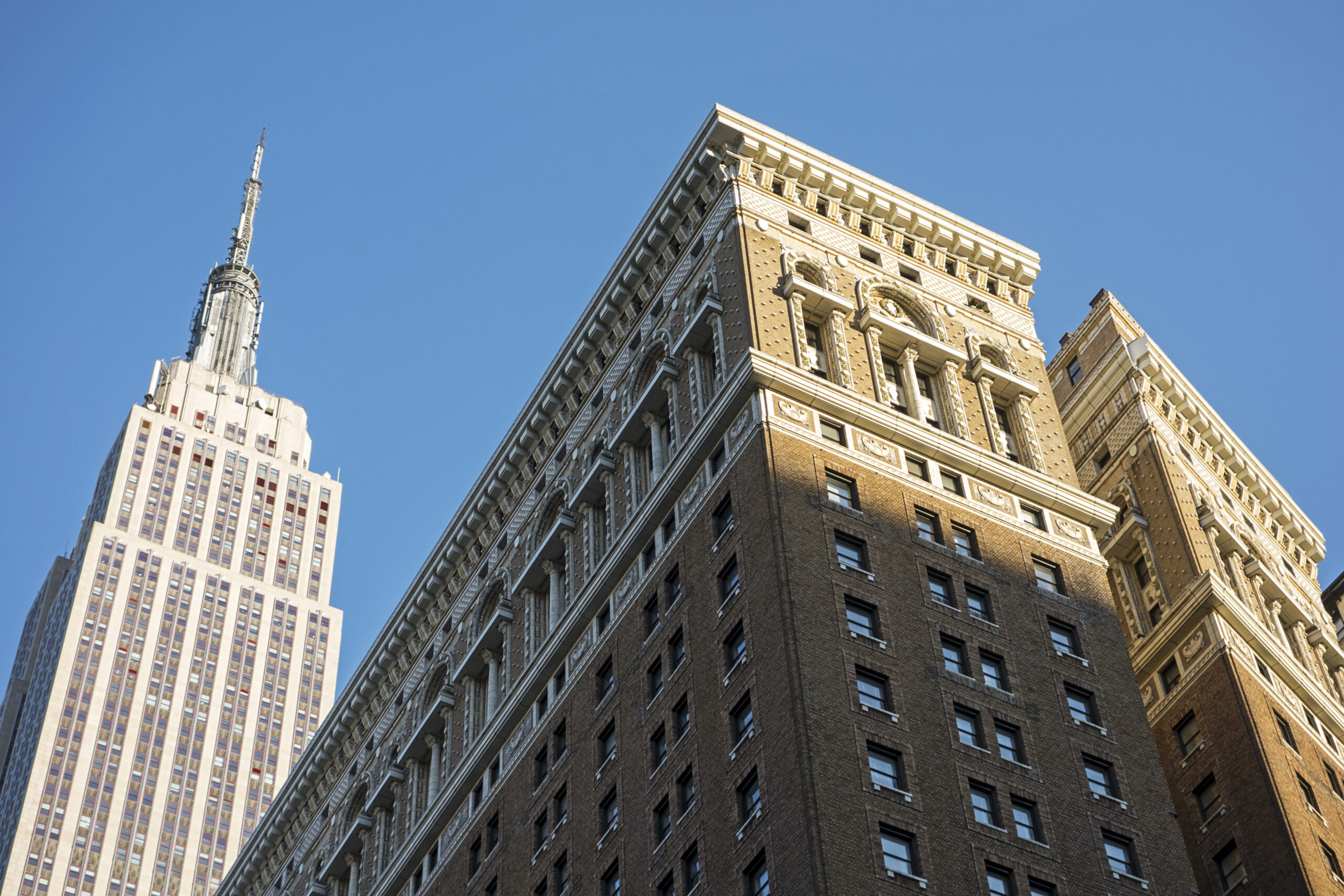 An image of the Empire state building seen from street level