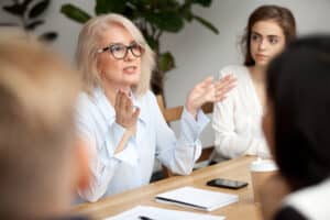 Female professional gesturing in a meeting