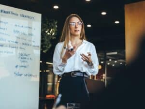 Female,Entrepreneur,Discussing,Her,Marketing,Strategy,With,Her,Team,In