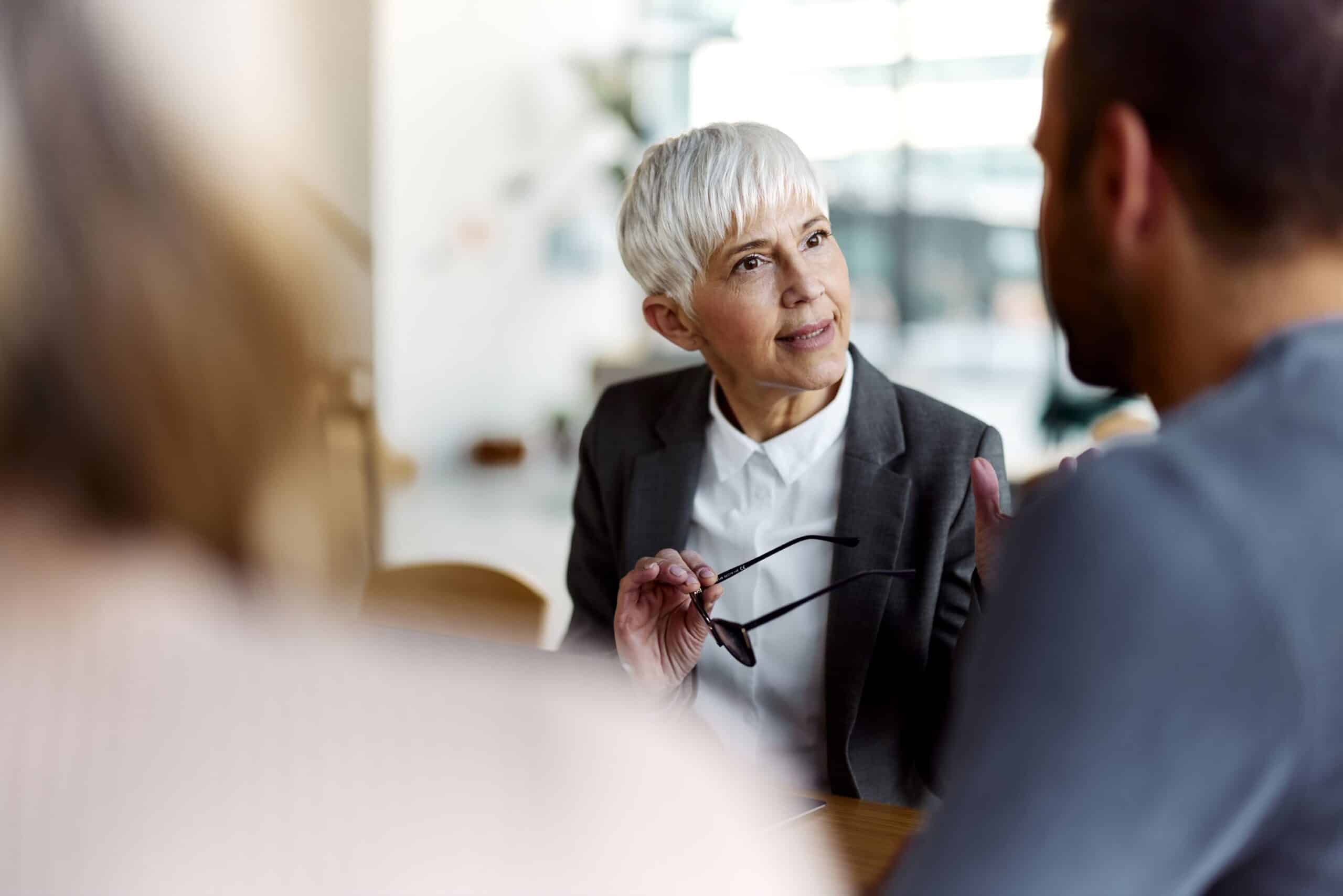 People engaging in a deep conversation in a corporate environment